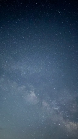 A star-filled night sky above West End Ranch