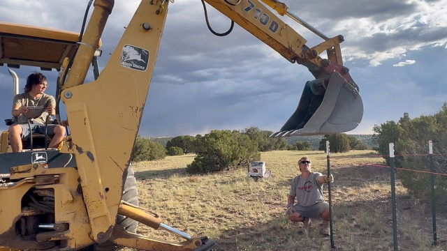 Family members working together with ranch equipment and fencing